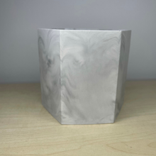 Load image into Gallery viewer, image shows an empty grey marble pot made from jesmonite by Troody Scrumptious with a smooth finish on a wooden background
