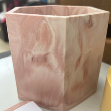 Load image into Gallery viewer, image shows a pen or make up brush pot in a hexagon shape with a red oxide marble colour made from jesmonite with a smooth finish
