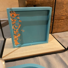 Load image into Gallery viewer, image shows a square trinket tray with a smooth finish in a teal colour with a copper coloured foil on the side
