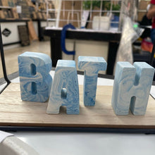 Load image into Gallery viewer, Jesmonite Alphabet Letters in Blue and white marble spelling the word Bath
